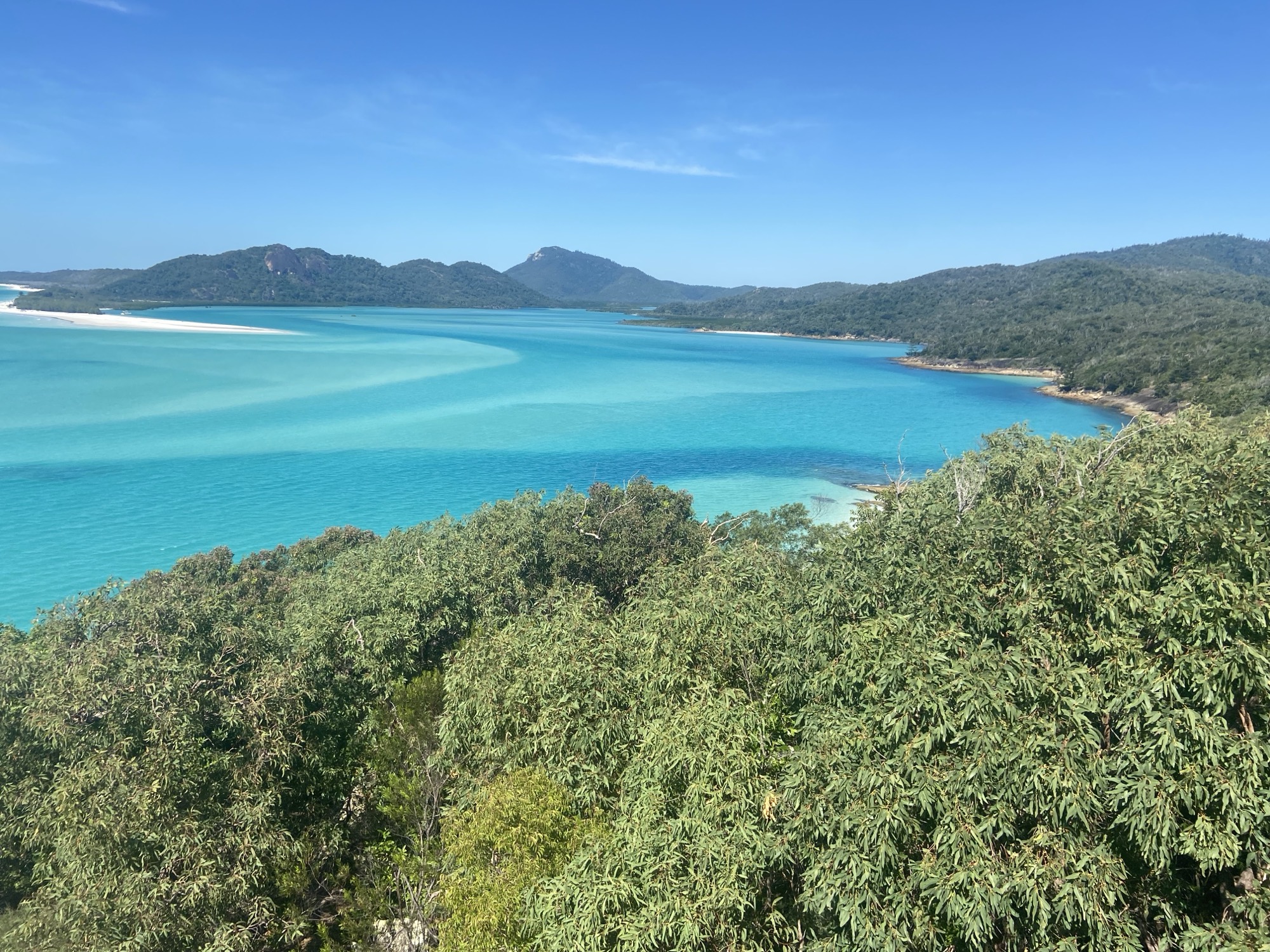 A turquoise bay framed by green hills — a stop on a designed gap year